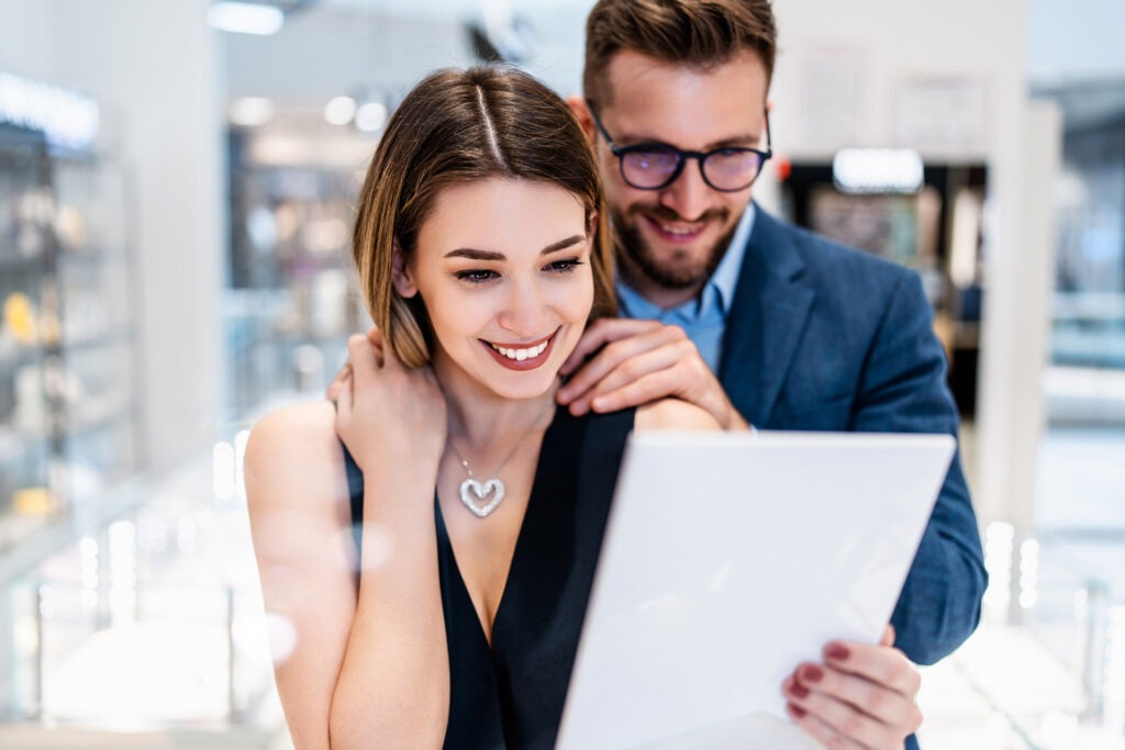 Beautiful couple in jewelry store
